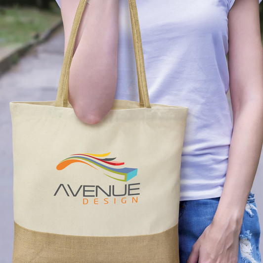 A cream tote bag with a contrasting brown bottom section, featuring a logo on the front.