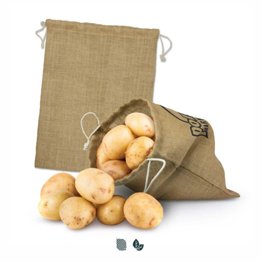 A large jute produce bag in beige, filled with fresh potatoes, with an empty bag beside it.