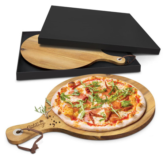 A wooden serving board with a handle, featuring a pizza topped with various ingredients. Comes in a black box.
