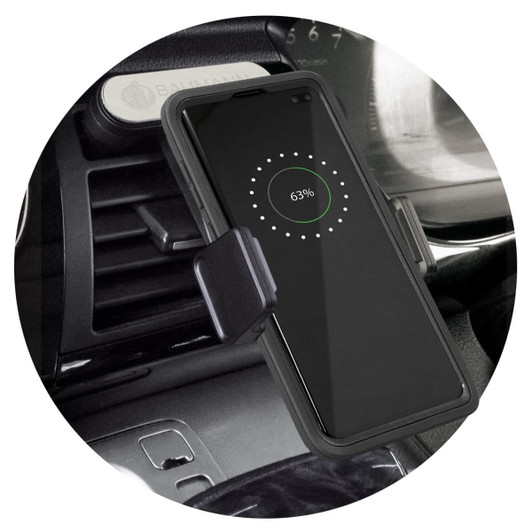 A black wireless charging phone holder mounted on a car dashboard, with a phone displaying a charging indicator.