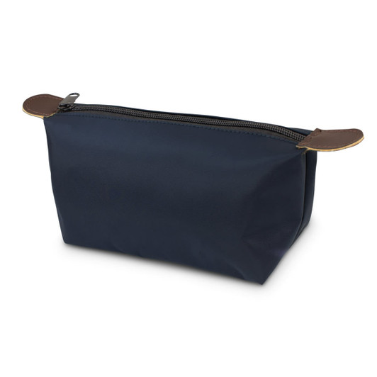 A navy toiletry bag with a zip closure and brown leather accents. It has a simple, clean design.