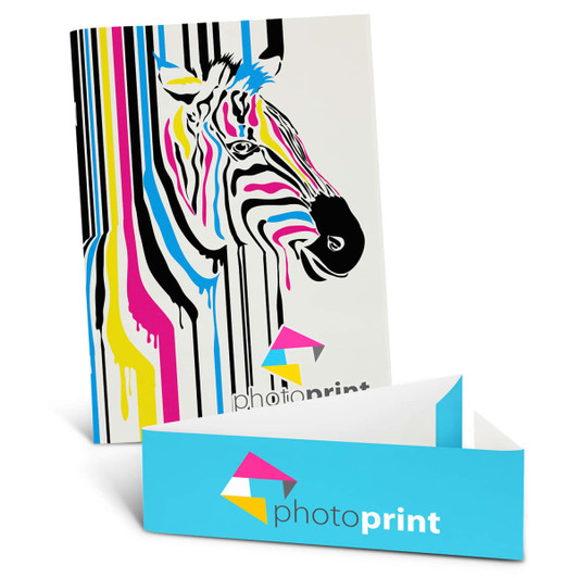 A large notebook with a vibrant zebra design featuring bold stripes in pink, blue, and black, alongside a branding box.