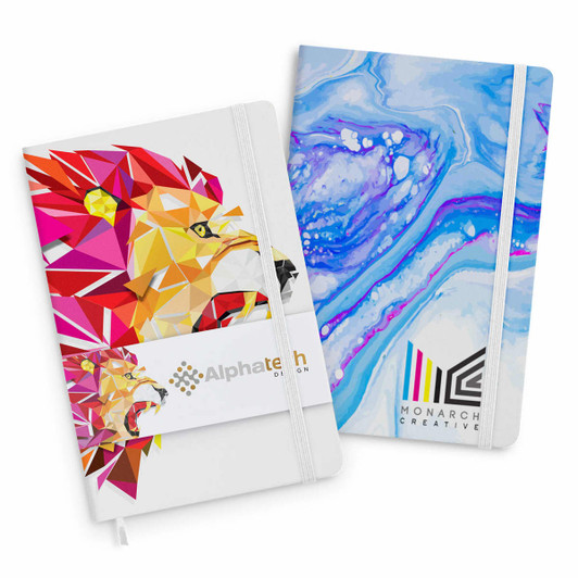 A set of two notebooks featuring vibrant designs: a lion graphic in red and a blue marbled pattern. Both have logos.