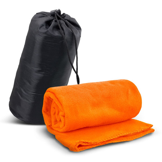 An orange fleece blanket is rolled up beside a black carry bag. The blanket features a neat edge finish.