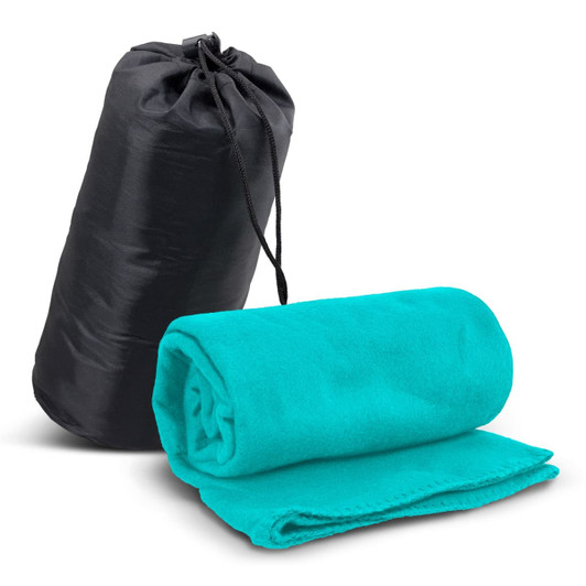 A teal fleece blanket rolled and resting beside a black carry bag with a drawstring closure.