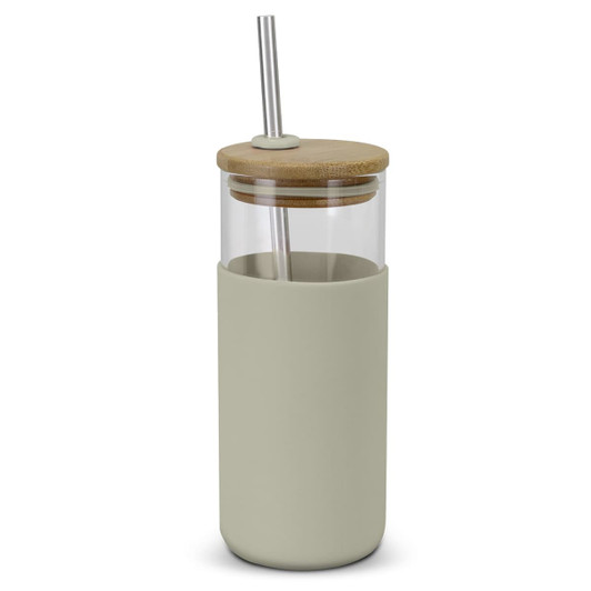 A glass tumbler with a light green silicone sleeve, bamboo lid, and stainless steel straw. It features a logo.