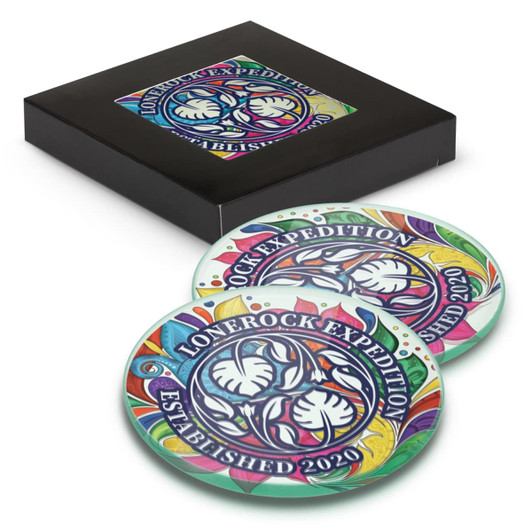 A round glass coaster set of two featuring vibrant colours and intricate floral designs, packaged in a black box.