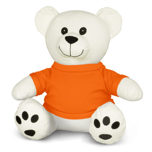 A white plush bear toy with an orange shirt and black paw prints, featuring a smiling face and rounded ears.