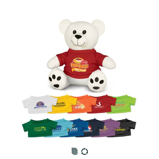 A white plush bear wearing a red shirt, surrounded by various colourful t-shirts in different shades.