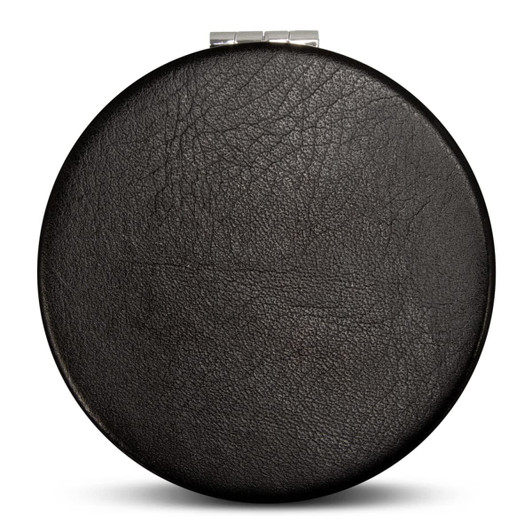 A round, black compact mirror featuring a textured surface and a metal clasp. The product has a simple design.