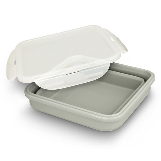 A collapsible lunch box in white and grey with a lid. It has a simple design and features a logo on the side.
