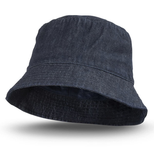 A denim bucket hat in dark blue with a wide brim and inner lining. It features a logo on the side.