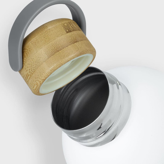 A drink bottle featuring a white steel body and a bamboo lid with a grey handle.