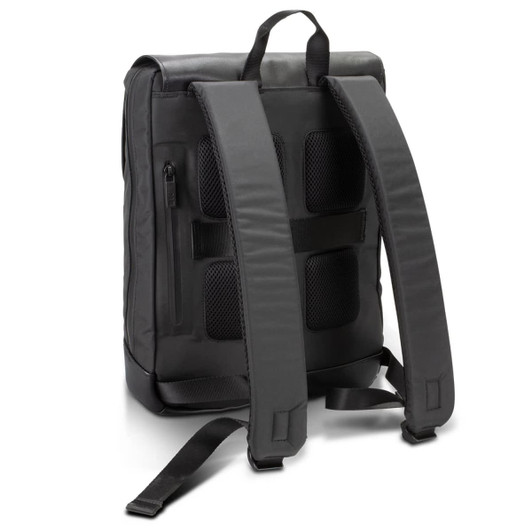 A black Moleskine Metro Slim Backpack featuring padded straps and a sleek design, with a logo on the surface.
