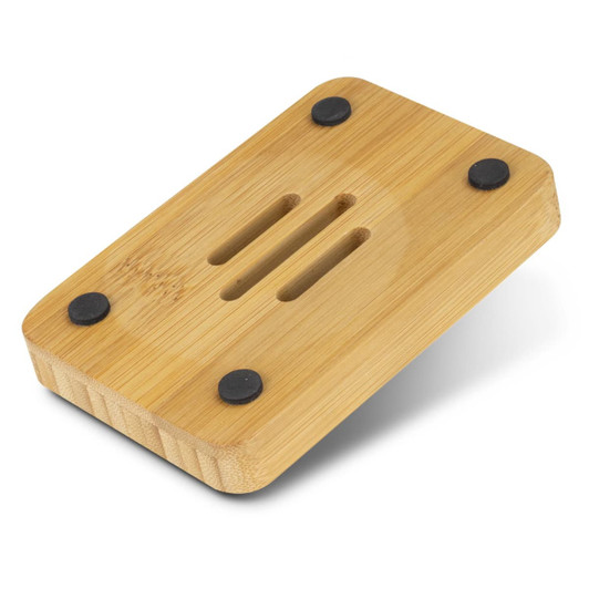 A bamboo soap holder with rounded edges and black rubber feet, featuring drainage grooves on the surface.