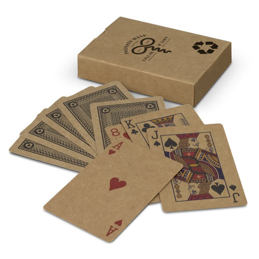 A set of kraft playing cards fanned out beside a kraft box, featuring red and black designs on the cards.