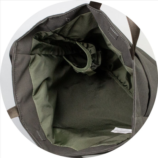 An olive green crossbody bag featuring a spacious interior with a soft lining and a built-in pocket.