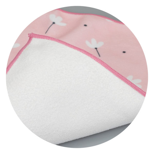 A medium blanket featuring a pink floral design on one side and a soft white underside. It has a contrasting pink trim.