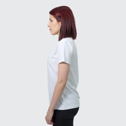 A side view of a woman wearing a white TRENDSWEAR Viva women's T-shirt. The shirt has a simple design and a logo.