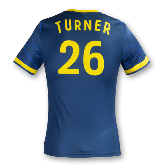 A blue women's soccer top with yellow accents and a logo, featuring the name "Turner" and the number "26" on the back.