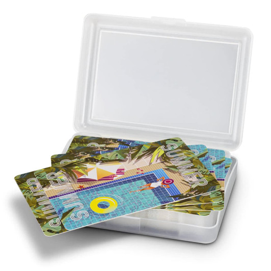 A gift case containing a set of colourful playing cards featuring a vibrant poolside design.