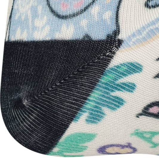 A patterned sock featuring light blue, black, and pastel colours, with various designs and a logo on the ankle.