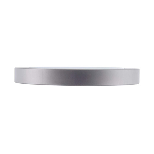 A sleek silver wireless charger with a minimalist design and a round shape. It features a logo on the surface.
