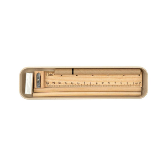 A stationery set featuring a ruler, pencil, sharpener, and eraser, all housed in a sleek, neutral-colored case.