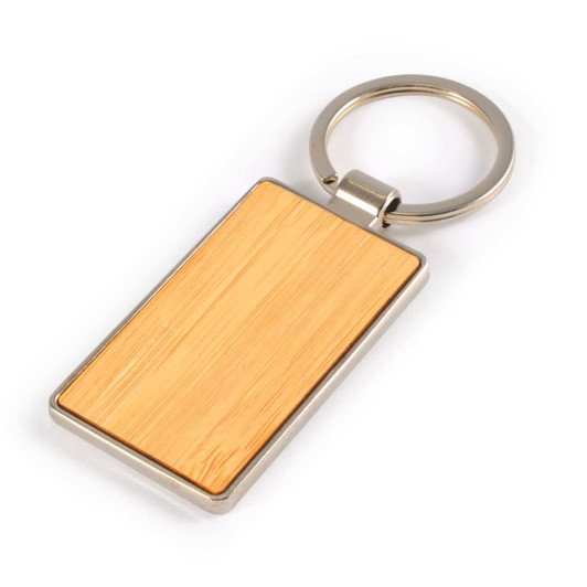 A rectangular bamboo keytag with a zinc metal keyring, featuring a smooth wooden surface.