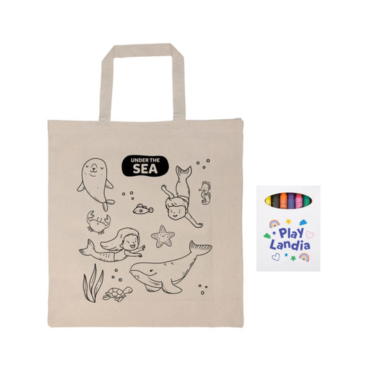 A beige calico bag with sea-themed outlines and a pack of colorful crayons. The bag has a logo.