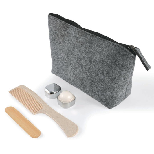A gray felt cosmetic bag with a zipper, accompanied by a wooden comb, a round cream container, and a silver lid.