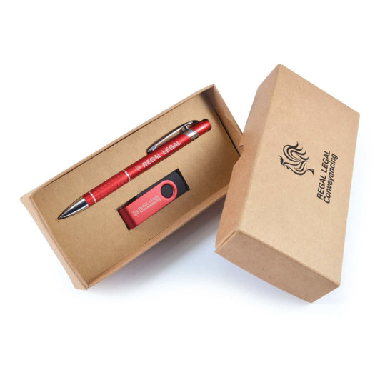 A red pen and a USB drive are presented in a brown cardboard gift box. The box has a logo.