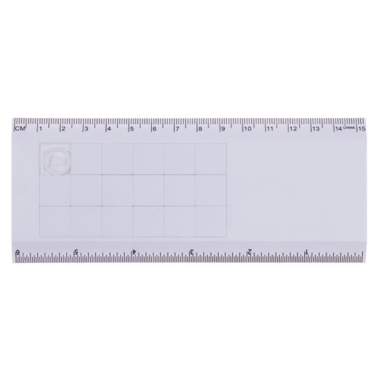 Amaze Tile Ruler Puzzle in translucent white with grid and measurement markings, featuring a branding logo.