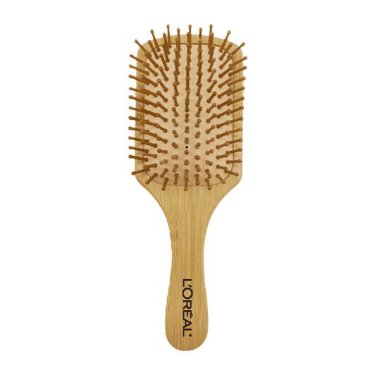 A bamboo hairbrush with a flat paddle design and rounded wooden bristles. Features a branding logo on the handle.