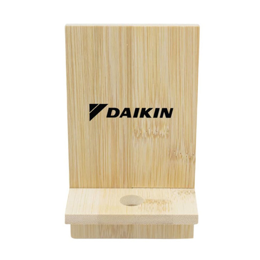 A bamboo phone stand with a simple design, featuring a slot for the device and an engraved logo.