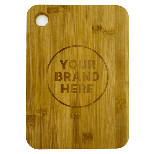 A large bamboo cutting board with rounded edges and a hole for hanging, featuring a logo in the centre.