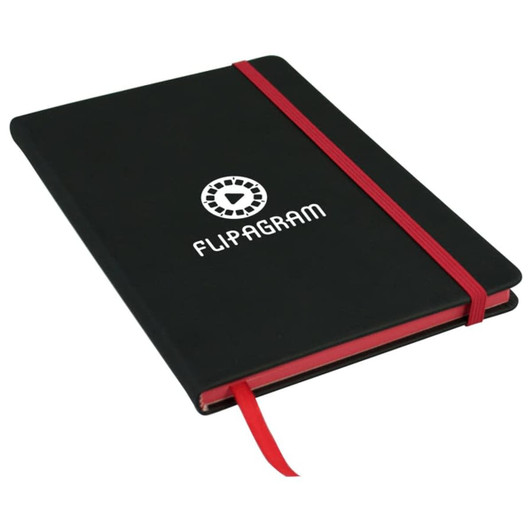 A black A5 journal with a red elastic band and ribbon bookmark, featuring a logo on the cover.