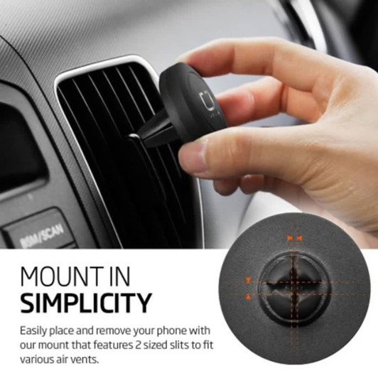 A round black car phone holder with a logo, being attached to an air vent by a hand.