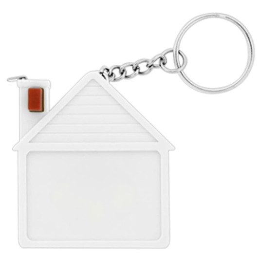 A white house-shaped tape measure with a keychain attachment. The design features a chimney and textured roof lines.