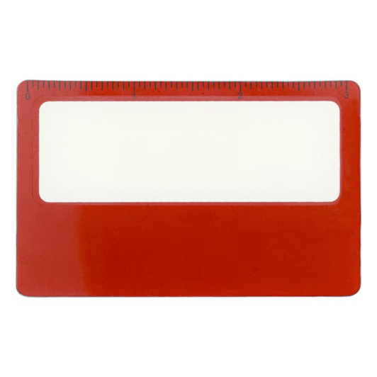 A red pocket ruler magnifier with a clear viewing area and a measurement scale on top.