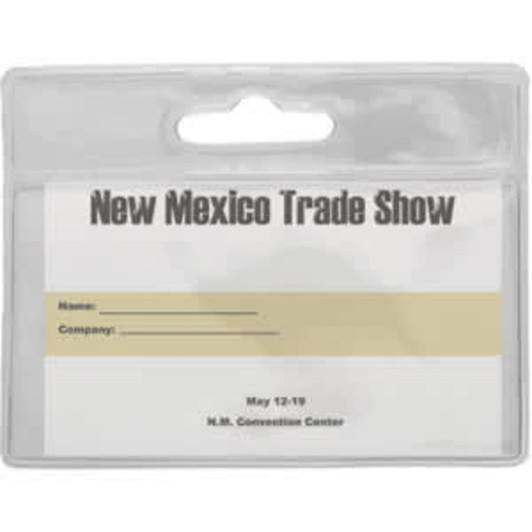 A clear, plastic badge holder with a top slot for hanging. It features a blank area for writing names and company details.