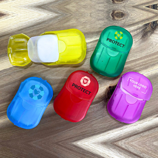 A collection of small, colourful containers in yellow, green, red, blue, and purple, featuring various logos and branding.