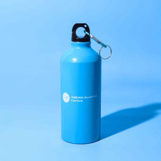 A drink bottle in bright blue with a keyring attachment and a logo on the side.