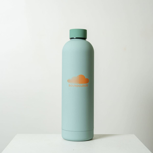 A drink bottle in a mint green colour with a sleek design and a circular logo.