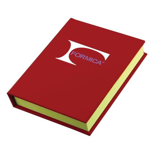 A red sticky note book with a yellow interior and a logo on the front cover.