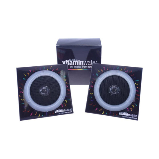 Pyramid Foldable Speakers in black and silver, displayed with branding in the background.