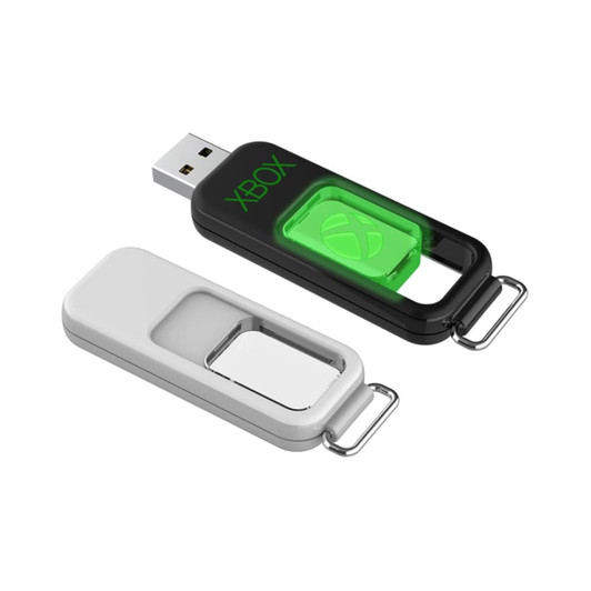 A black and white flash drive with a green logo, featuring a sliding mechanism. It has a keychain attachment.