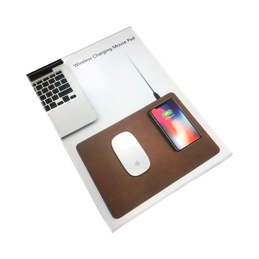 A brown wireless charging mouse pad with a mouse and a smartphone, alongside a laptop. The mouse pad features a logo.