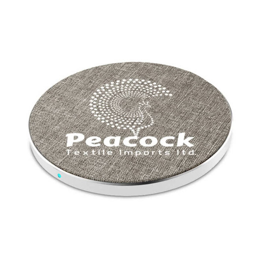 A round wireless charger in grey fabric with a white base and a logo.