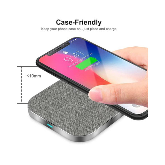 A square wireless charger with a grey fabric finish, designed to charge phones while in their case.